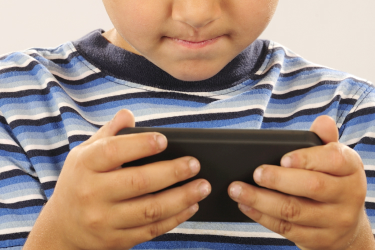 Kid playing phone