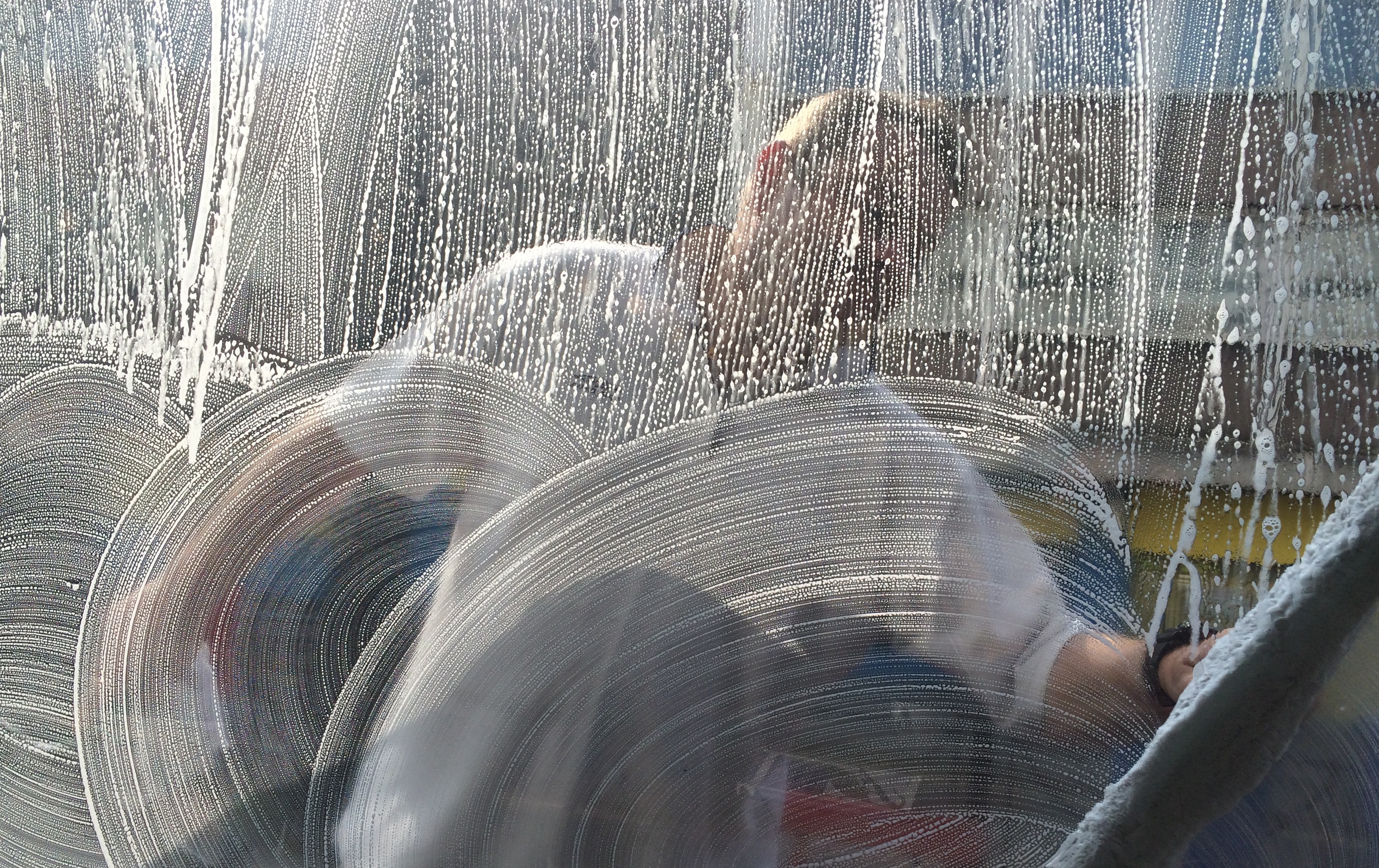man cleaning outside window 2