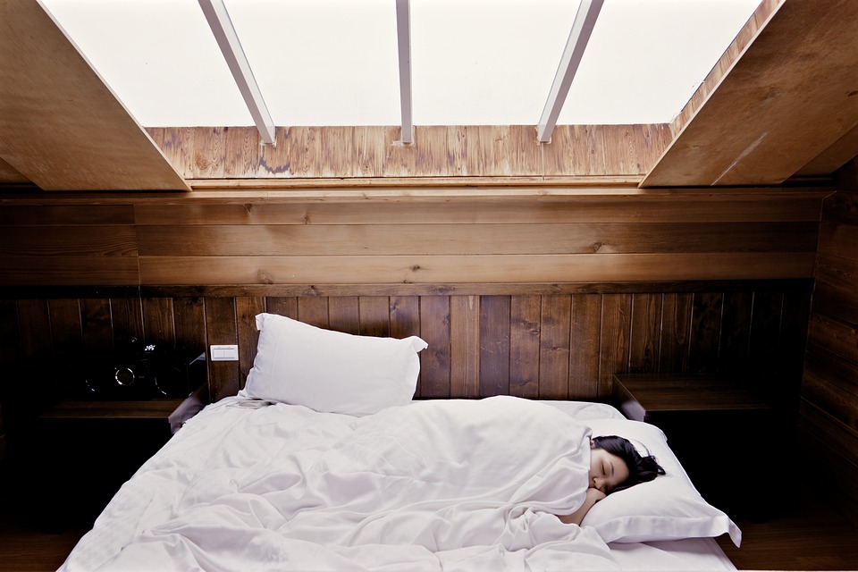 woman sleeping on bed