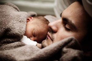 baby and daddy sleeping